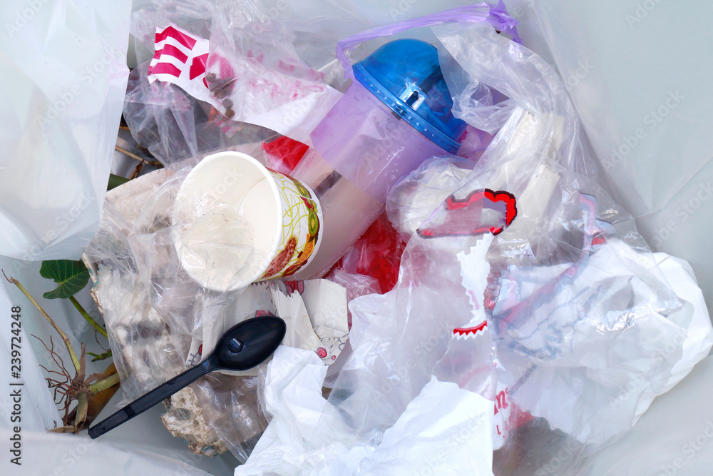 top view of plastic bottle water drink waste and straws in recycle bin  dirty, pile of