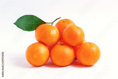 mandarin with a leaf isolated over white background