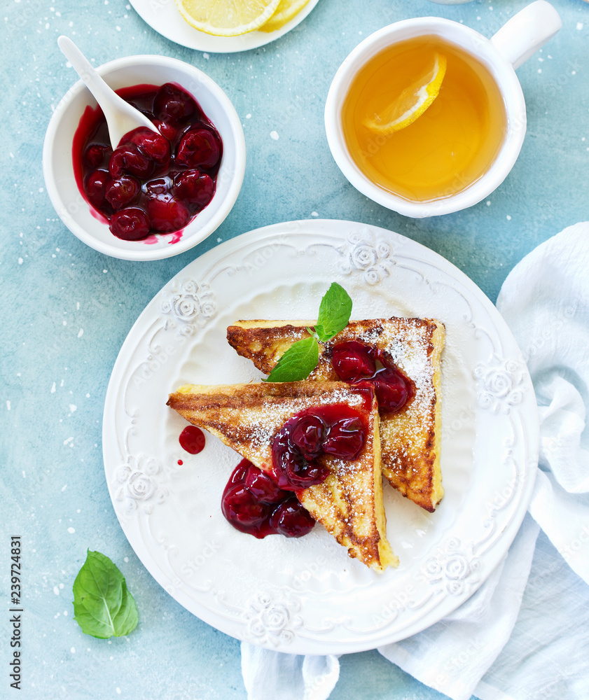French toast with cherry sauce.