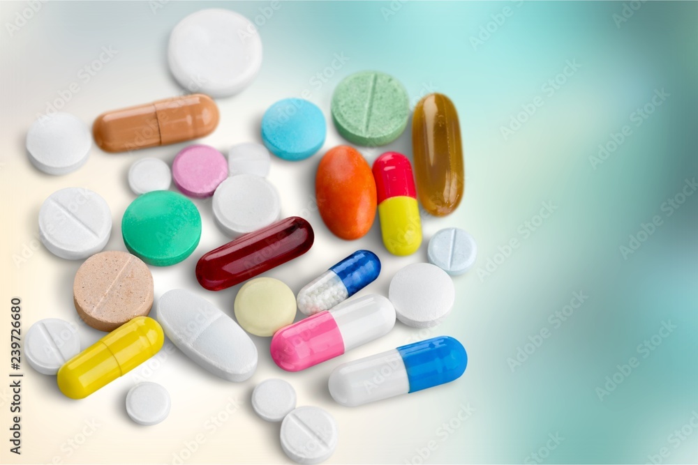 Colorful pills and tablets on background Colorful pills and tablets on background