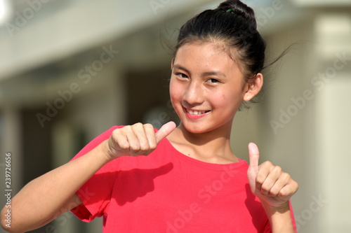 Cute Minority Teen Girl With Thumbs Up