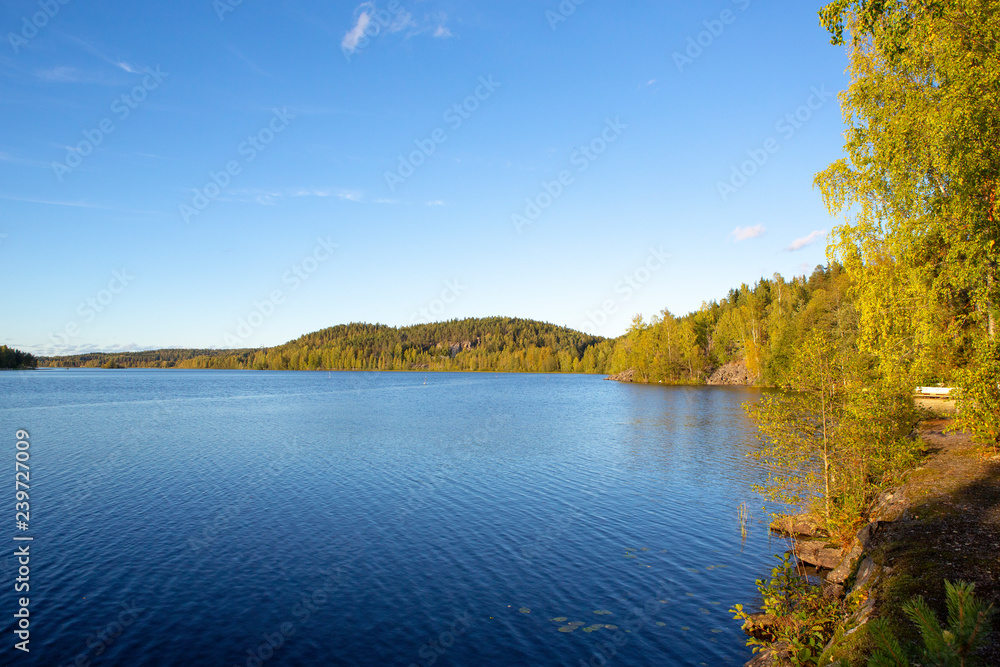 Summer scenery at the lake in Finland. Beautiful lake view with blue sky.
