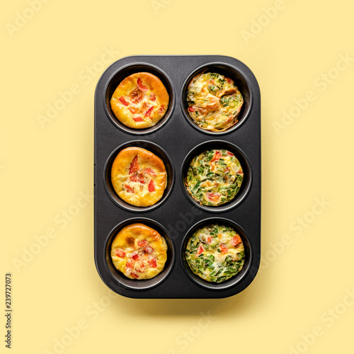 Healthy breakfast egg muffins with cheese, tomato and green veggetable, easy and healthy food concept photo