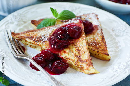 French toast with cherry sauce.