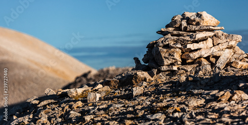 Pile of rocks on the top of Focalone mount, in the background the slope of Acquaviva mount, amphitheater of the Murelle, Majella national park, Abruzzo, Italy, Europe photo