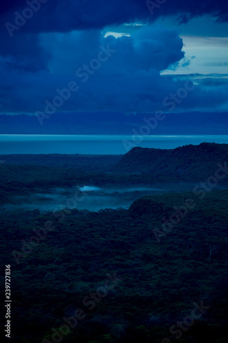 Aerial view of rain forest and lake in Ethiopia in pre-dawn hours. © Wollwerth Imagery