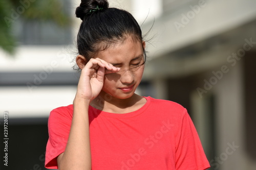Youthful Asian Female Crying
