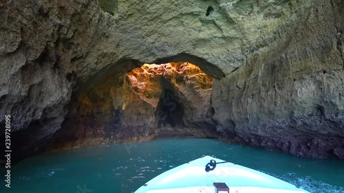 Lagos, Portugal - April 2018: Natural rock formations at the coastline in Praia da Marinha viewed from popular boat cave tour along Algarve coast, Lagos, Portugal