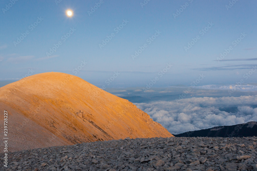 The moon rise over the Mount Acquaviva in the amphitheater of the Murelle, Majella national park, Abruzzo, Italy, Europe The moon rise over the Mount Acquaviva in the amphitheater of the Murelle, Majella national park, Abruzzo, Italy, Europe
