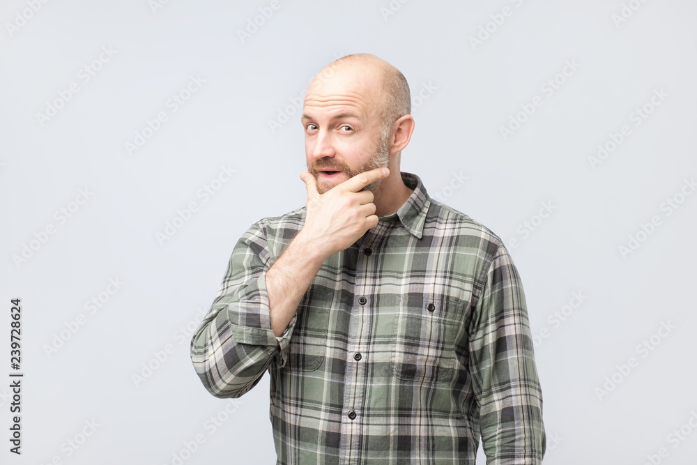 Middle aged man thinking, expressing leadership reflections and concerns, trying to make a decision. Middle aged man thinking, expressing leadership reflections and concerns, trying to make a decision.
