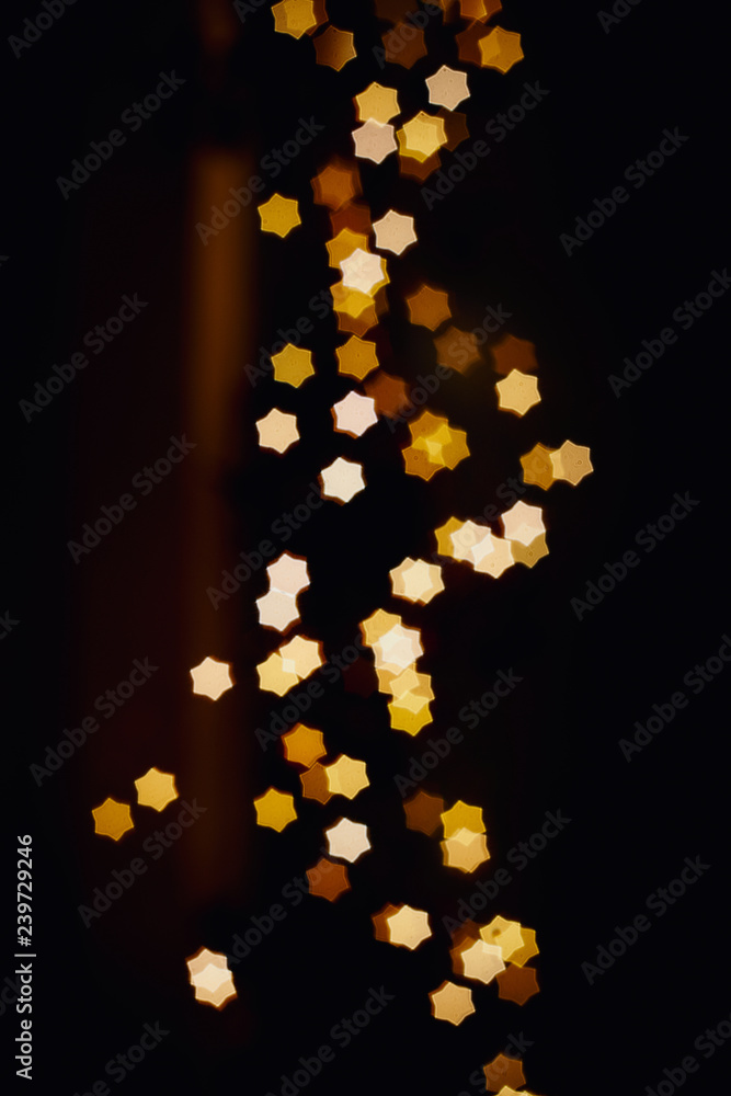 Blurring lights bokeh background of stars at christmastime