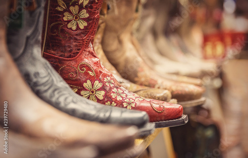 Fotobehang Cowboy boots in a store, vintage style shoes
