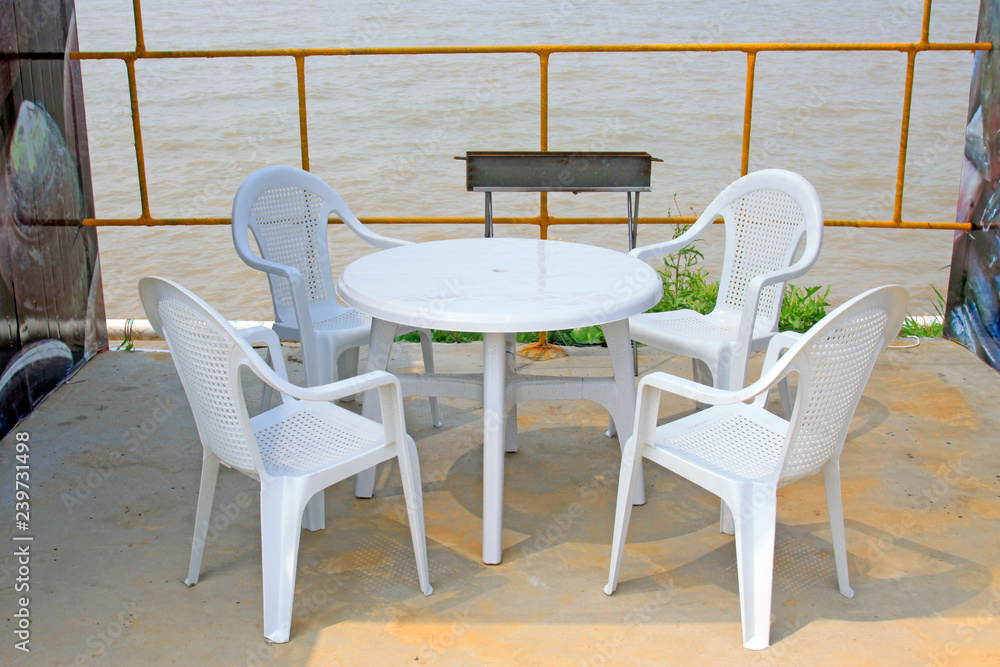 White plastic tables and chairs