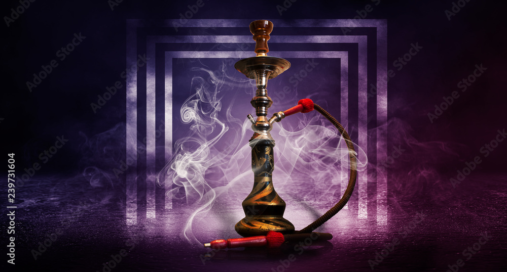 Purple, pink background of smoking hookah on the concrete floor, in clouds of smoke and neon light Purple, pink background of smoking hookah on the concrete floor, in clouds of smoke and neon light