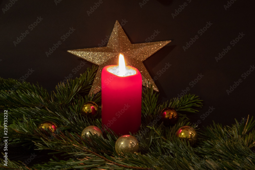 Christmas impressions with candle, fir branches, christmas decorations and christmassy pastries Christmas impressions with candle, fir branches, christmas decorations and christmassy pastries