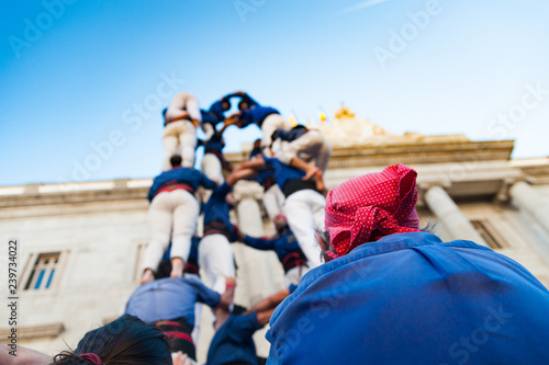 traditional catalan human towers known as castells are built by children castellers in front of generalitat palace photo