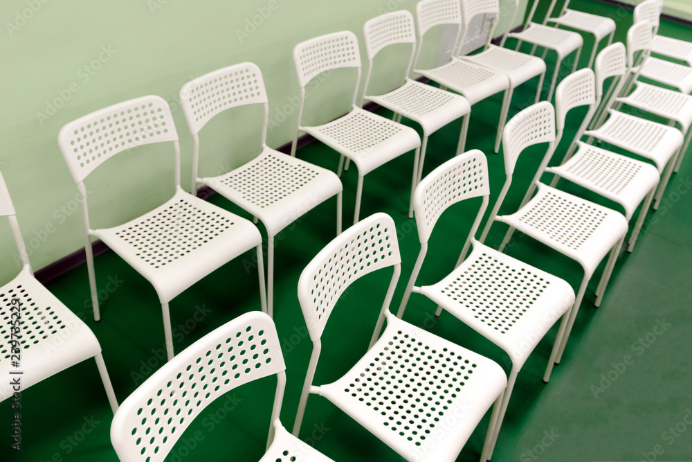 Obraz premium New white chairs are in the room for the audience of children's holiday