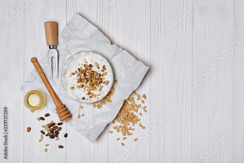 Wallpaper Mural Gourmet appetizer of white brie cheese or camembert with nuts and honey dipper Torontodigital.ca