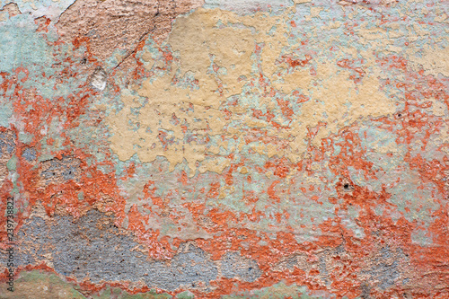 Old shabby orange paint on the wall.