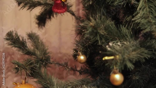 Wallpaper Mural The wind blows on a Christmas toy that hangs on the Christmas tree. Torontodigital.ca