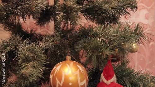 Wallpaper Mural The wind blows on a Christmas toy that hangs on the Christmas tree. Torontodigital.ca