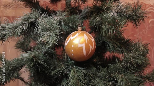 Wallpaper Mural The wind blows on a Christmas toy that hangs on the Christmas tree. Torontodigital.ca