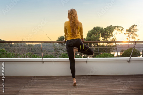 Beautiful woman doing yoga outdoor