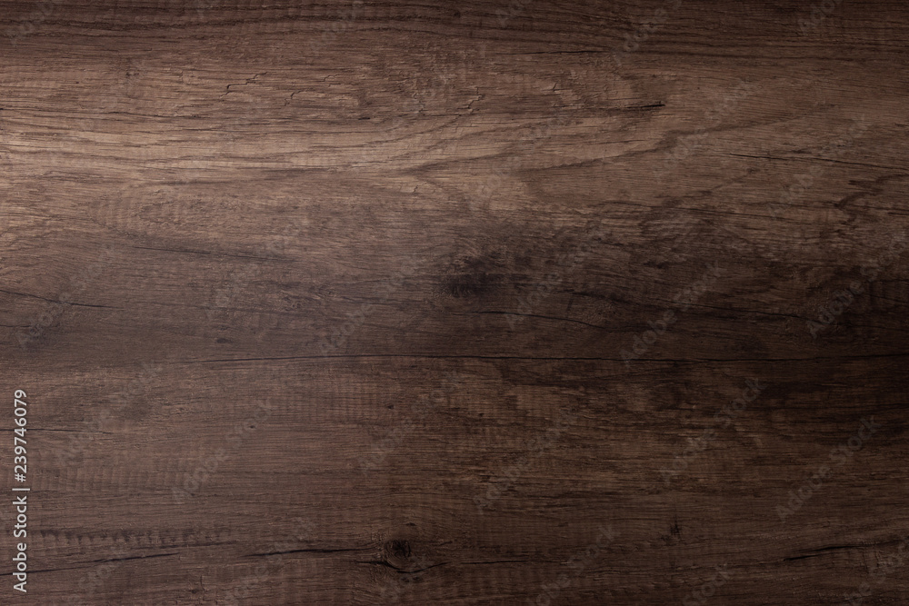 Naklejka premium Brown scratched wooden cutting board. Wood texture