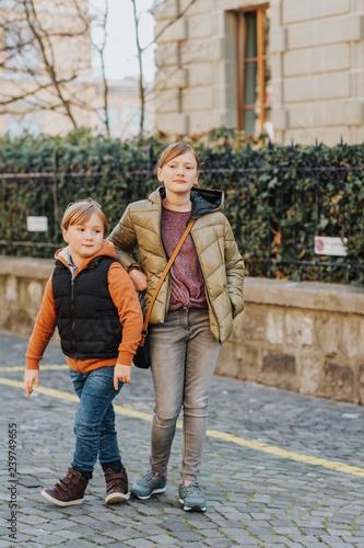 Wallpaper Mural Outdoor portrait of two kids wearing warm jackets, spring fashion for children Torontodigital.ca