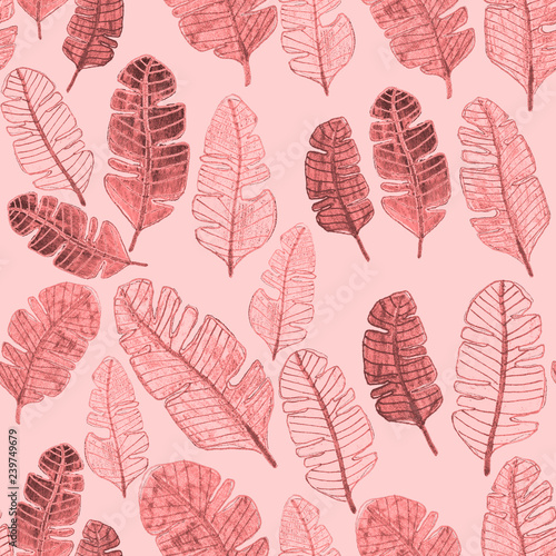 Seamless pattern with hand drawn tropical leaves.