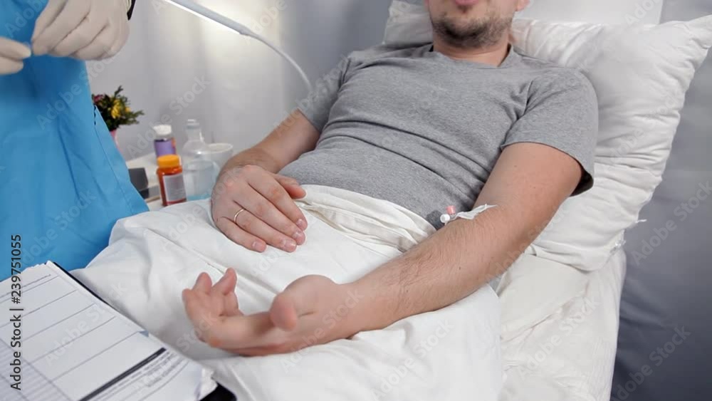 Doctor using syringe to make injection of vaccine to patient in hospital.The man are intravenous drug injection into the arm to heal illness patient elderly person Doctor using syringe to make injection of vaccine to patient in hospital.The man are intravenous drug injection into the arm to heal illness patient elderly person