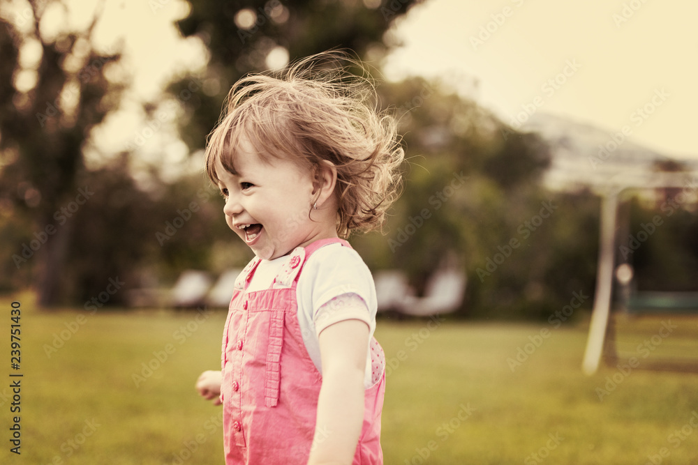 little girl spending time at backyard little girl spending time at backyard