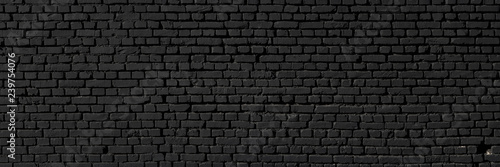 Black wall as background  texture of a black brick wall
