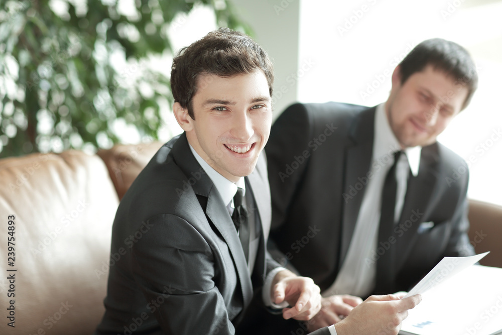 close up. a young businessman takes legal advice close up. a young businessman takes legal advice