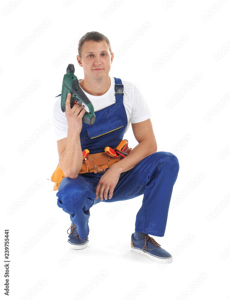 Electrician with drill wearing uniform on white background Electrician with drill wearing uniform on white background