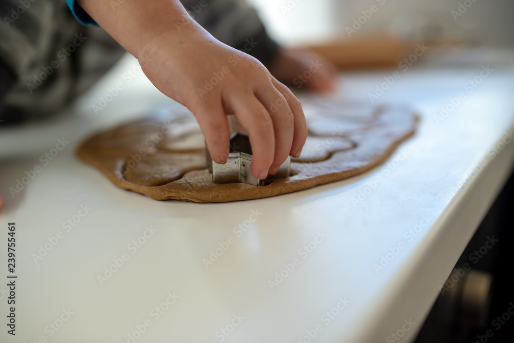 Fototapeta premium Closeup view of toddler child hand making cookies