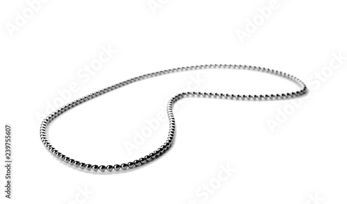 Chain of small magnetic balls on white background