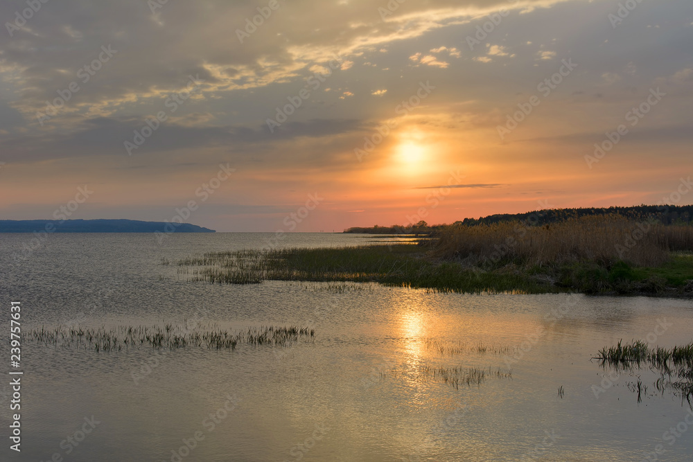 Sunset over the river in the spring