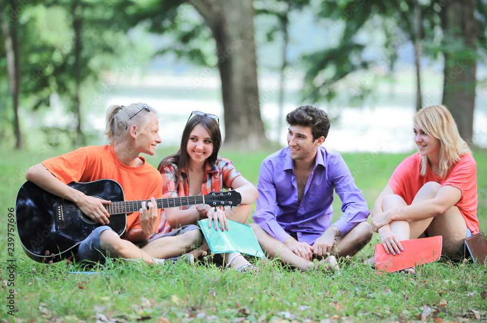 group of students resting in the city Park group of students resting in the city Park