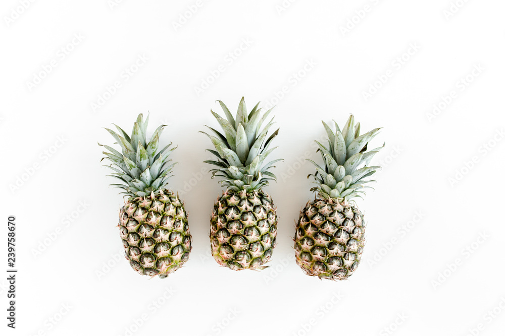 Pineapples isolated on white background. Food concept. Flat lay, top view Pineapples isolated on white background. Food concept. Flat lay, top view