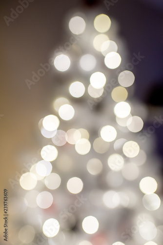 white christmas tree out of focus in blur background