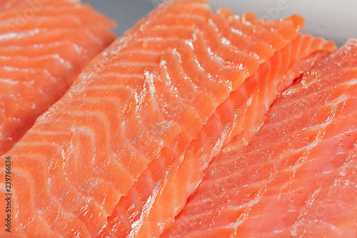 Close up fresh salmon slices for sishi. Tradition japanishe seafood concept