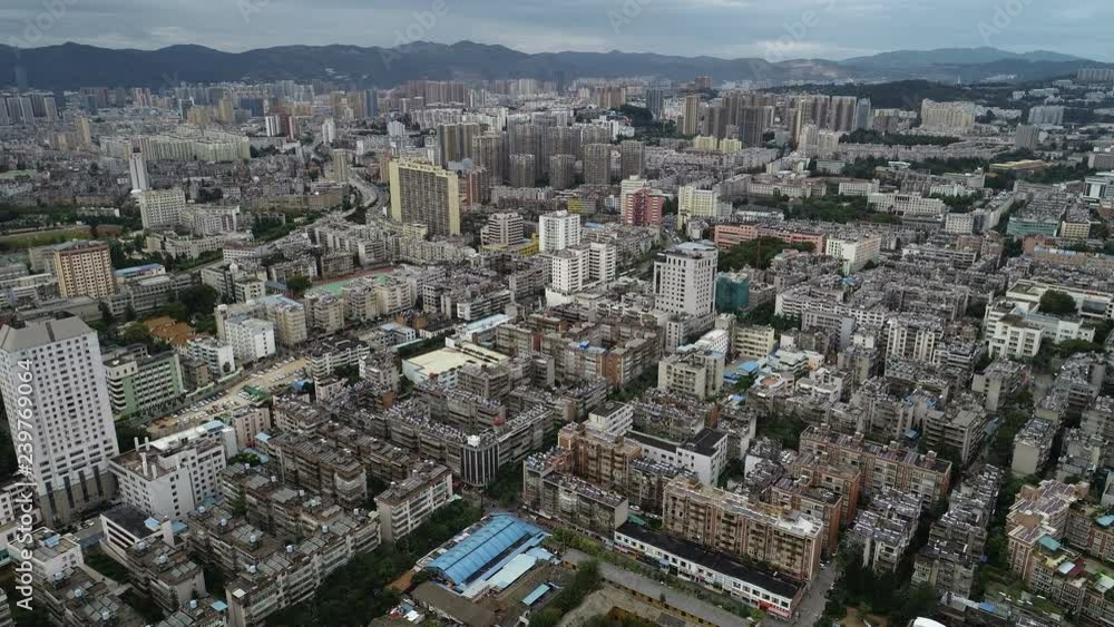 Drone shot of residential apartment buildings and suburbs of Kunming in China Drone shot of residential apartment buildings and suburbs of Kunming in China