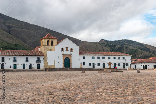 Villa De Leyva famous colonial central square “Plaza Mayor”, cobblestone covered, in Boyaca, Colombia