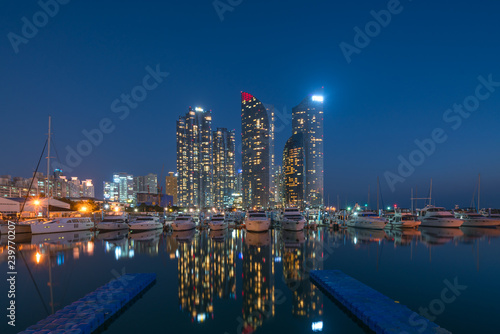 Busan city skyline view at Haeundae district  Gwangalli Beach with yacht pier at Busan  South Korea.