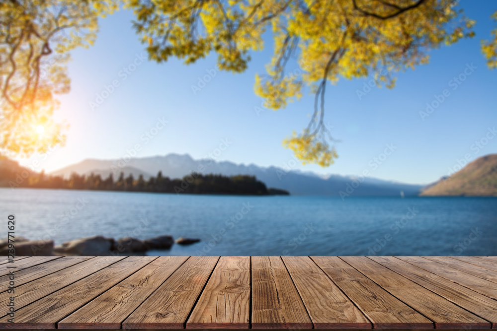 Naklejka premium Perspective Wood Display on Blur Lake view