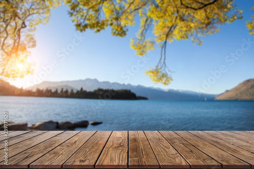 Fototapeta Naklejka Na Ścianę i Meble -  Perspective Wood Display on Blur Lake view