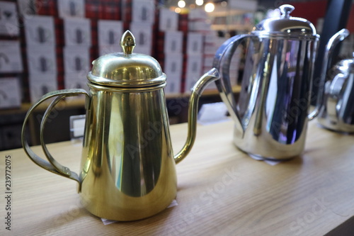 teapot and cup on wooden table