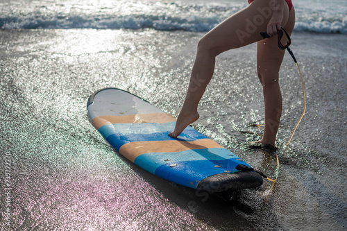 Photography Happy girl in bikini have fun before surfing Surfer lie on surf board
