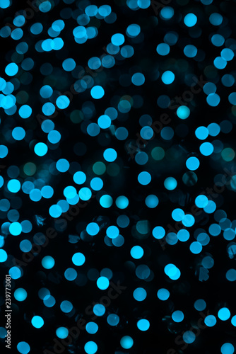 Color abstract bokeh on dark background.